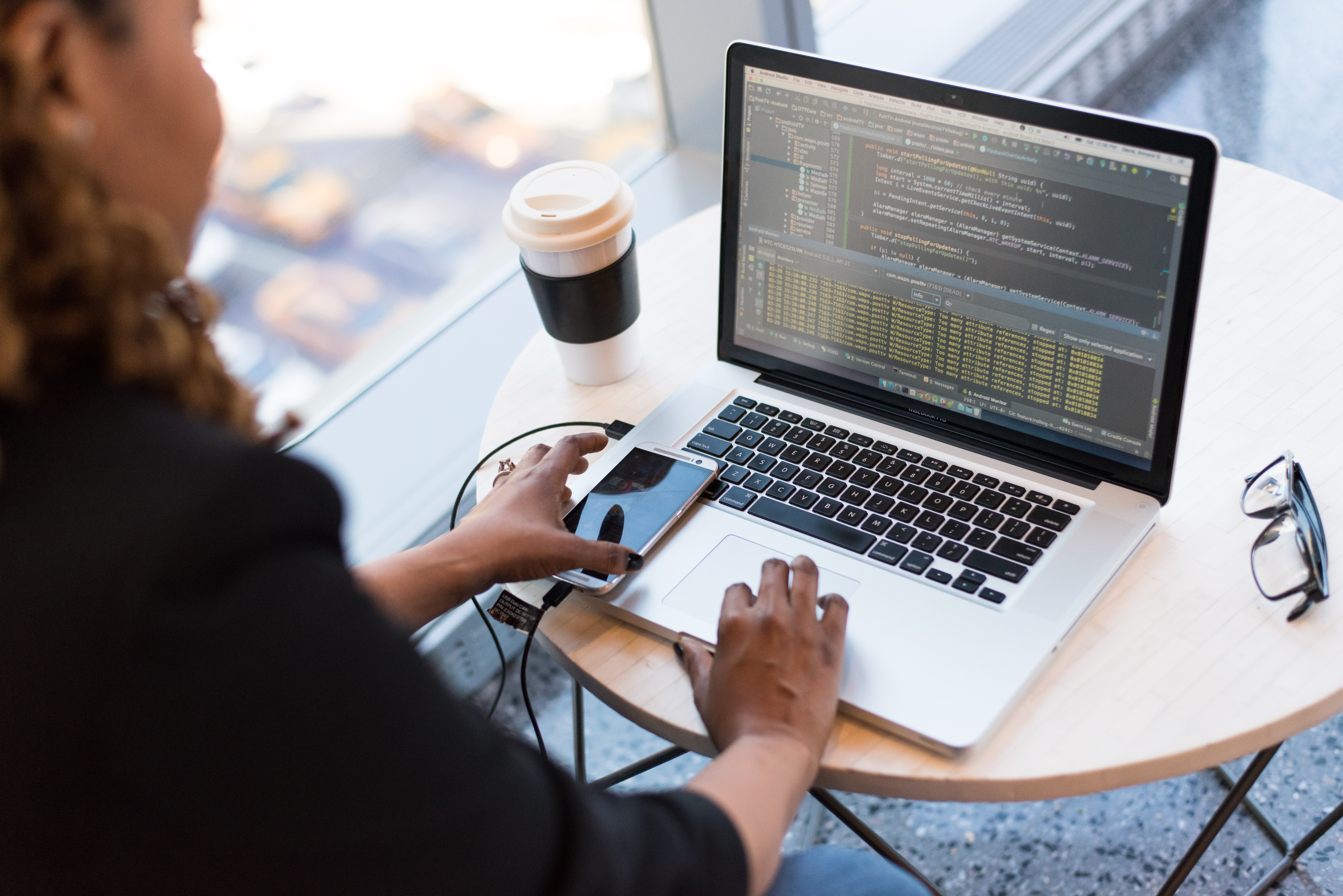 Woman software engineer coding a web app