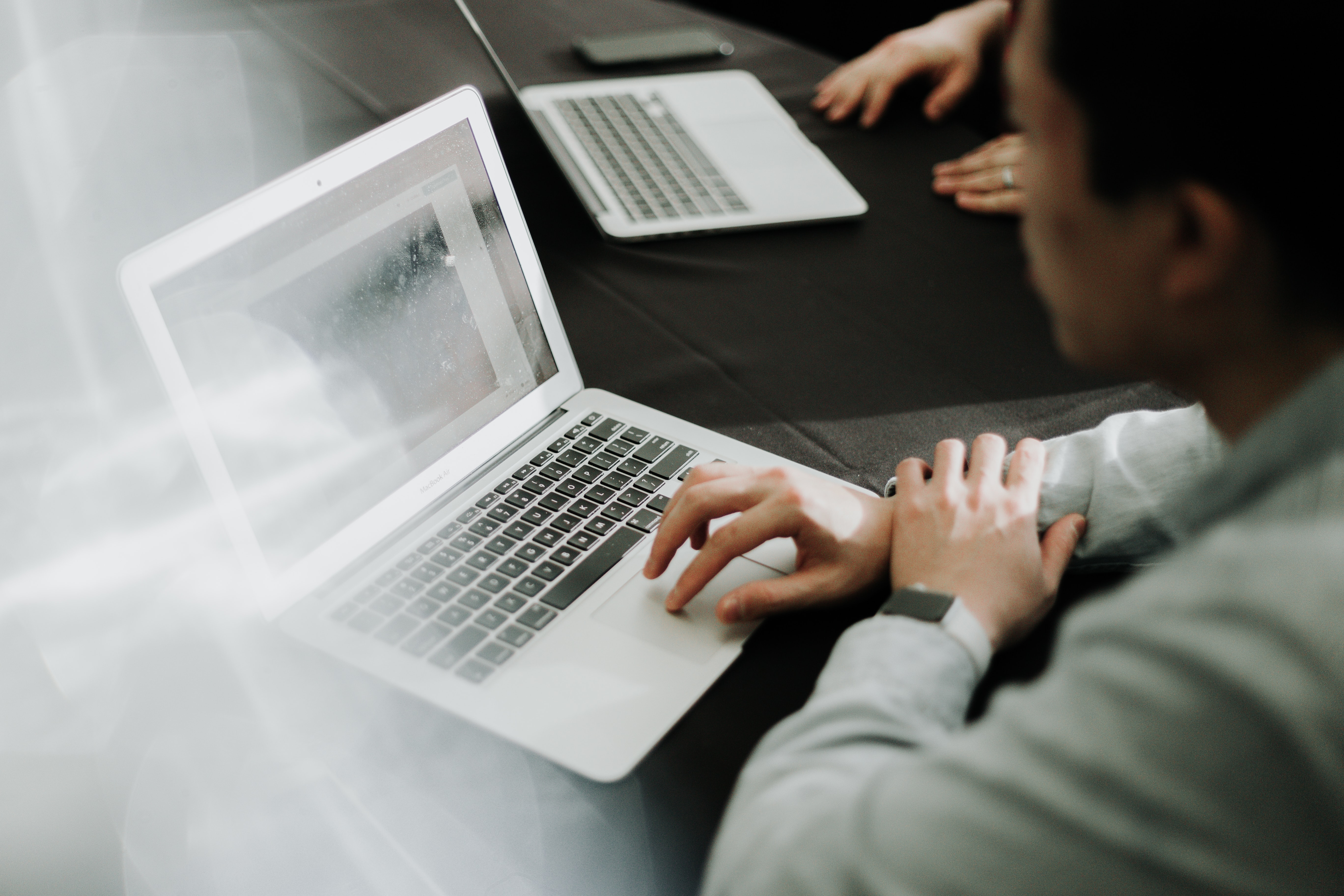 Closeup of an employee working on a laptop